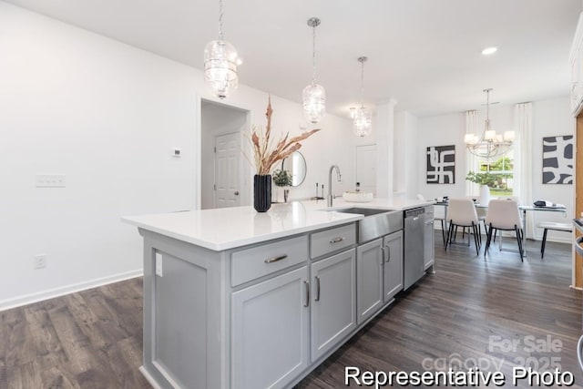 24558 Blue Heron Cir Unit 402, Lancaster, SC 29720 - kitchen with stainless steel dishwasher, dark wood-type flooring, a chandelier, a sink, and light countertops
