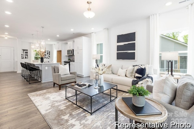 24558 Blue Heron Cir Unit 402, Lancaster, SC 29720 - living room with visible vents, light wood-type flooring, a chandelier, and recessed lighting