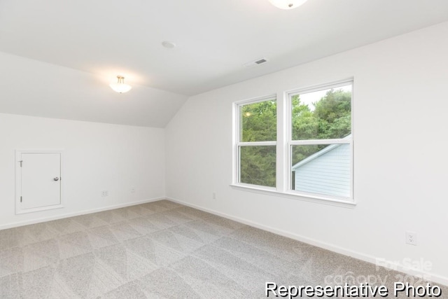 24558 Blue Heron Cir Unit 402, Lancaster, SC 29720 - additional living space with light carpet, visible vents, baseboards, and vaulted ceiling