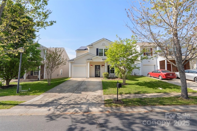 8917 Chalkstone Rd, Charlotte, NC 28216 - view of front facade featuring an attached garage, a front lawn, and driveway