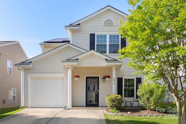 8917 Chalkstone Rd, Charlotte, NC 28216 - traditional-style house with an attached garage, covered porch, and driveway