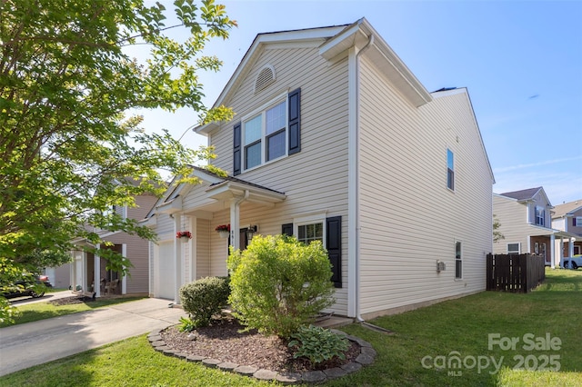 8917 Chalkstone Rd, Charlotte, NC 28216 - view of front of property featuring driveway, a front lawn, and fence