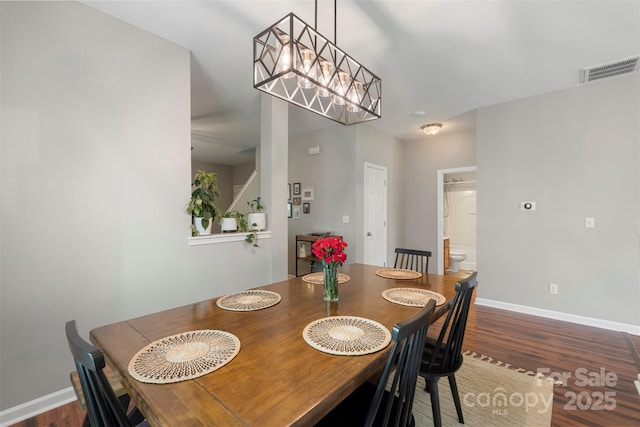 8917 Chalkstone Rd, Charlotte, NC 28216 - dining area featuring visible vents, baseboards, and wood finished floors