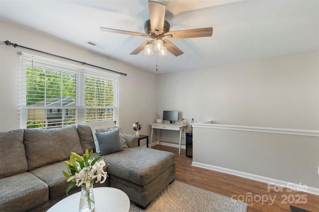8917 Chalkstone Rd, Charlotte, NC 28216 - living area with wood finished floors, visible vents, baseboards, and ceiling fan