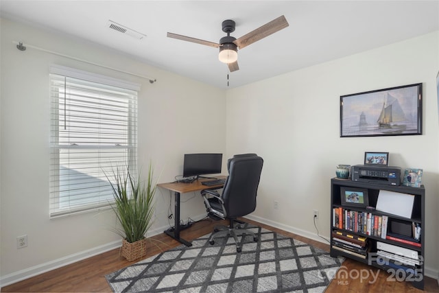 8917 Chalkstone Rd, Charlotte, NC 28216 - home office with baseboards, plenty of natural light, ceiling fan, and wood finished floors