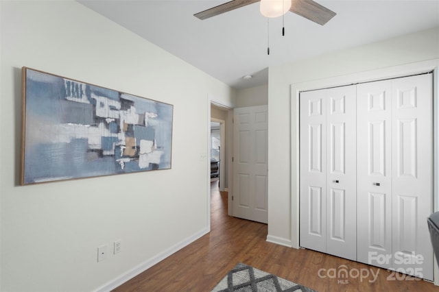 8917 Chalkstone Rd, Charlotte, NC 28216 - unfurnished bedroom with baseboards, wood finished floors, a closet, and ceiling fan
