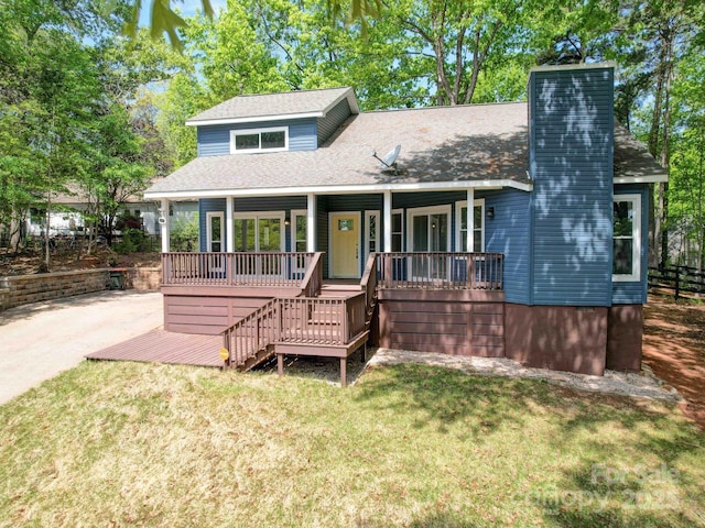 16149 Haroa Ct, Tega Cay, SC 29708 - view of front facade with a front yard, roof with shingles, a chimney, and a porch