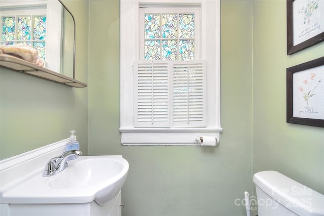 bathroom with vanity and toilet