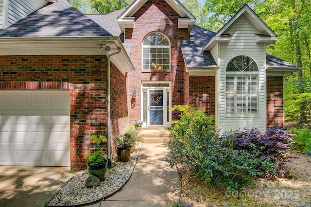 4516 Stryker Dr, Matthews, NC 28104 - view of front of home with driveway, an attached garage, a shingled roof, and brick siding