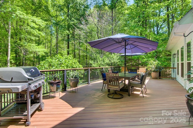 4516 Stryker Dr, Matthews, NC 28104 - wooden terrace with outdoor dining area, area for grilling, and a view of trees