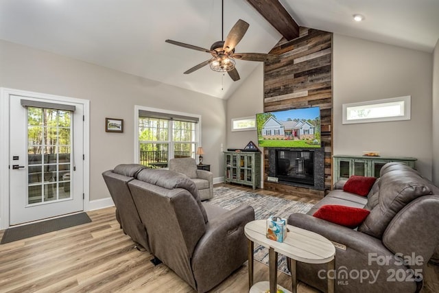 4594 N Wynswept Dr, Maiden, NC 28650 - living area featuring high vaulted ceiling, a ceiling fan, a large fireplace, beamed ceiling, and light wood finished floors