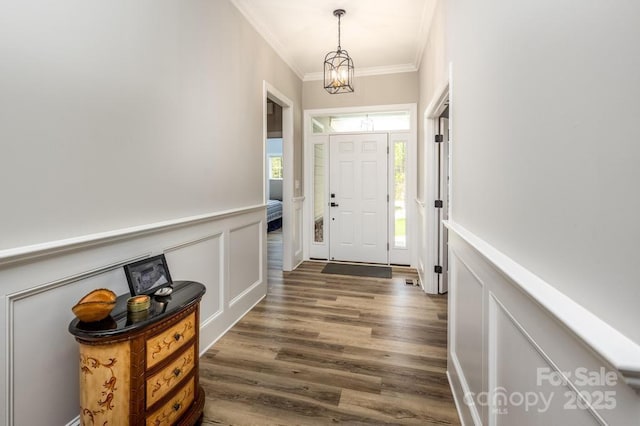 4594 N Wynswept Dr, Maiden, NC 28650 - entryway featuring a decorative wall, an inviting chandelier, a wainscoted wall, dark wood finished floors, and ornamental molding