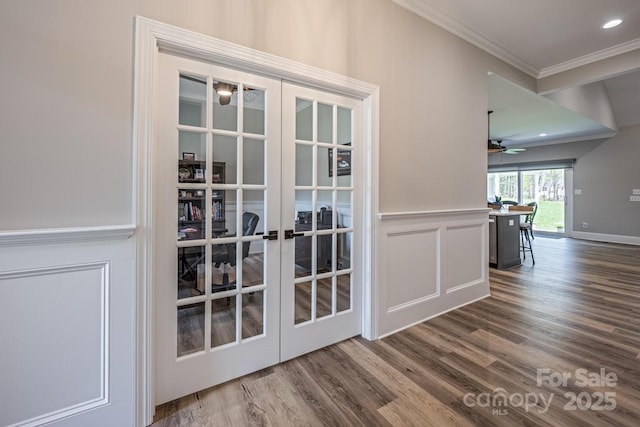 4594 N Wynswept Dr, Maiden, NC 28650 - doorway featuring french doors, dark wood finished floors, ceiling fan, a decorative wall, and ornamental molding