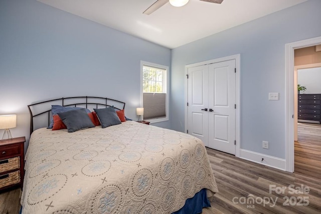 4594 N Wynswept Dr, Maiden, NC 28650 - bedroom with baseboards, a ceiling fan, wood finished floors, and a closet