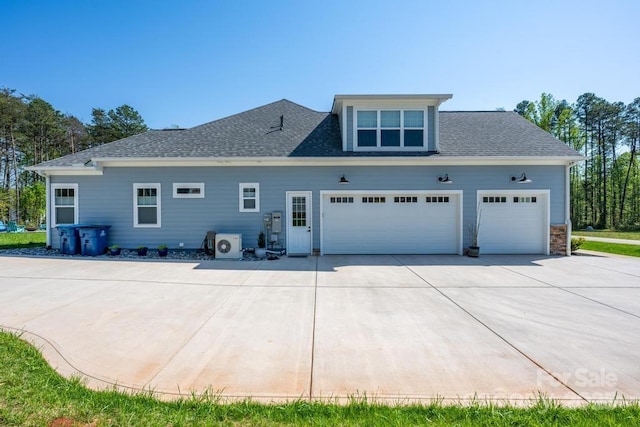 4594 N Wynswept Dr, Maiden, NC 28650 - rear view of house featuring an attached garage, driveway, and roof with shingles