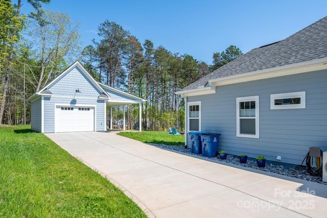 4594 N Wynswept Dr, Maiden, NC 28650 - view of home's exterior with a lawn, roof with shingles, a carport, and concrete driveway