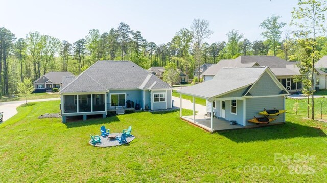 4594 N Wynswept Dr, Maiden, NC 28650 - back of property with a lawn and a sunroom