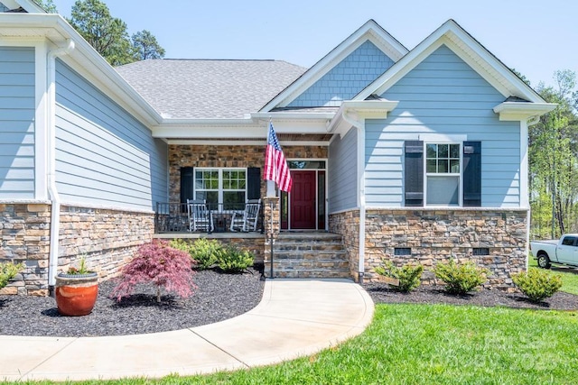 4594 N Wynswept Dr, Maiden, NC 28650 - doorway to property with stone siding, a porch, and roof with shingles