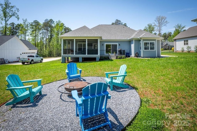 4594 N Wynswept Dr, Maiden, NC 28650 - rear view of house with a shingled roof, an outdoor fire pit, a sunroom, and a yard