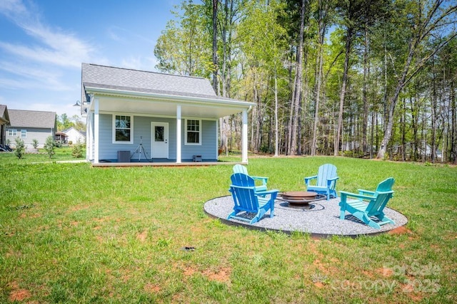 4594 N Wynswept Dr, Maiden, NC 28650 - view of yard with a fire pit, a porch, and cooling unit