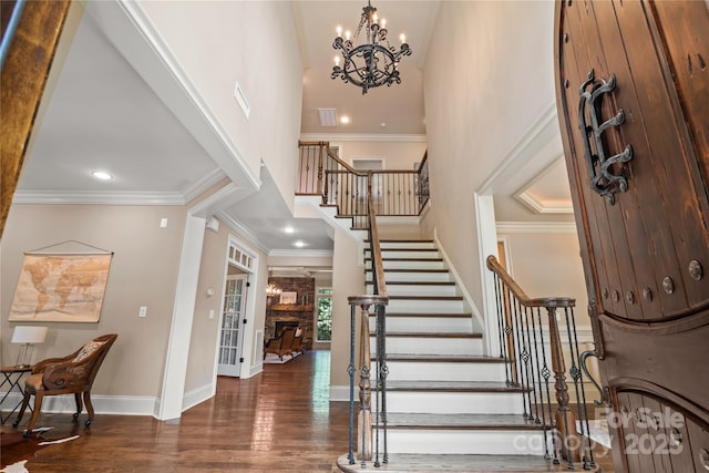 14130 Lea Point Ct, Huntersville, NC 28078 - foyer entrance with stairs, a high ceiling, wood finished floors, baseboards, and a chandelier