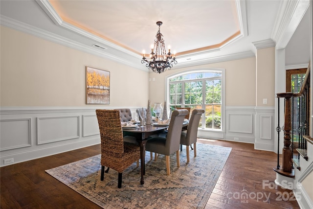 14130 Lea Point Ct, Huntersville, NC 28078 - dining area featuring a raised ceiling, stairway, a chandelier, crown molding, and dark wood-style flooring
