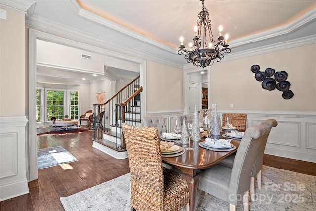 14130 Lea Point Ct, Huntersville, NC 28078 - dining room with a chandelier, hardwood / wood-style floors, ornamental molding, stairs, and a raised ceiling