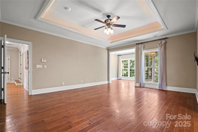 14130 Lea Point Ct, Huntersville, NC 28078 - empty room featuring a tray ceiling, ceiling fan, dark wood-style flooring, crown molding, and baseboards