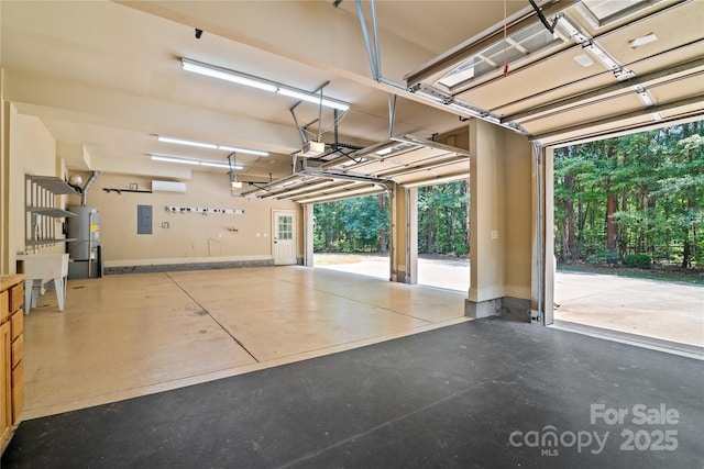 14130 Lea Point Ct, Huntersville, NC 28078 - garage featuring gas water heater, electric panel, and a wall mounted air conditioner