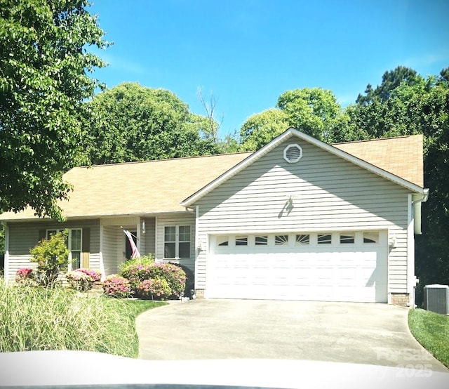 317 Robert Keever Rd, Stanley, NC 28164 - ranch-style house with an attached garage, concrete driveway, and central AC