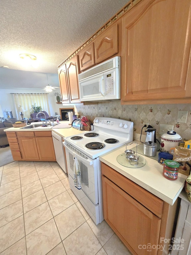 317 Robert Keever Rd, Stanley, NC 28164 - kitchen featuring white appliances, light countertops, light tile patterned floors, a textured ceiling, and tasteful backsplash