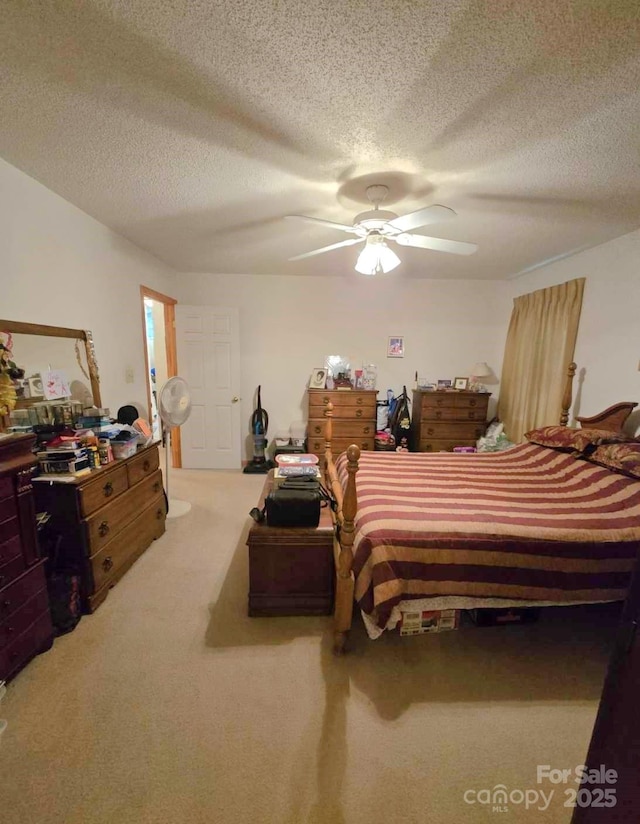 317 Robert Keever Rd, Stanley, NC 28164 - bedroom with carpet flooring, a textured ceiling, and a ceiling fan