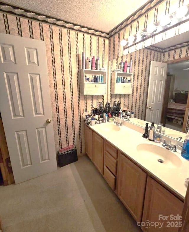 317 Robert Keever Rd, Stanley, NC 28164 - bathroom featuring wallpapered walls, double vanity, and a textured ceiling