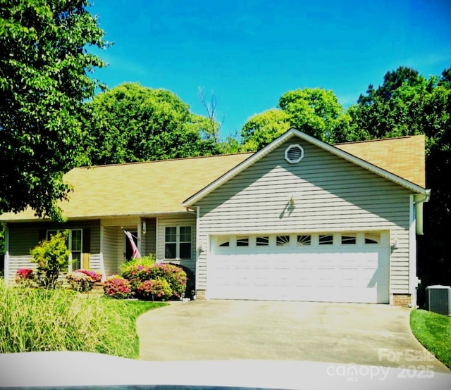 317 Robert Keever Rd, Stanley, NC 28164 - single story home featuring an attached garage, concrete driveway, and central air condition unit
