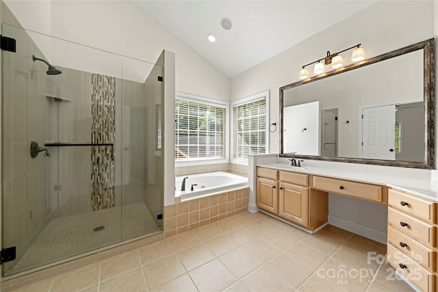 bathroom featuring a shower stall, a bath, vanity, lofted ceiling, and tile patterned flooring