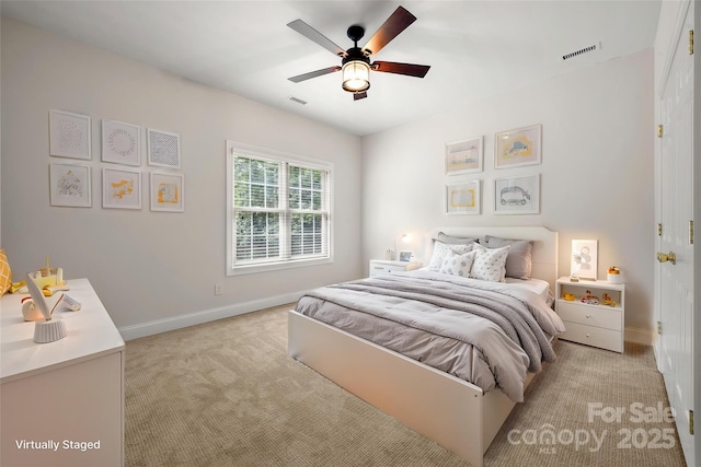 bedroom featuring light carpet, baseboards, visible vents, and a ceiling fan