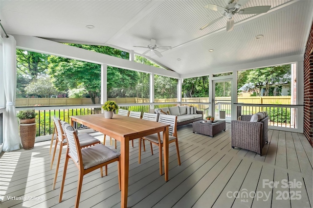 sunroom with outdoor lounge area, outdoor dining area, and ceiling fan