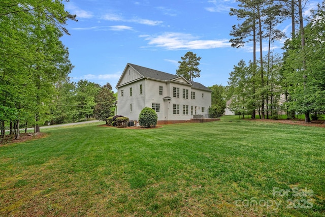 view of side of property featuring a yard