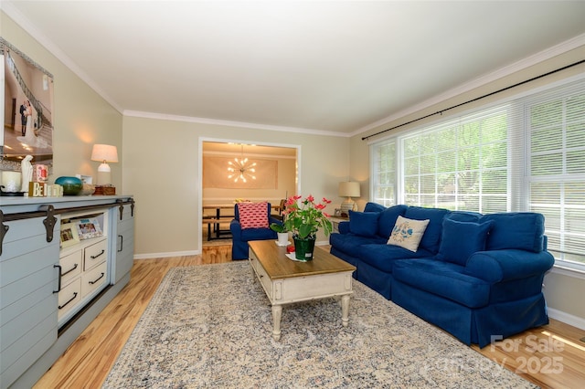 10316 Whitethorn Dr, Charlotte, NC 28277 - living area featuring light wood-style flooring, baseboards, a notable chandelier, and crown molding