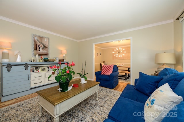 10316 Whitethorn Dr, Charlotte, NC 28277 - living room with baseboards, wood finished floors, a chandelier, and ornamental molding