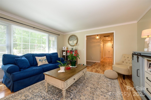 10316 Whitethorn Dr, Charlotte, NC 28277 - living room featuring visible vents, light wood-style floors, and crown molding