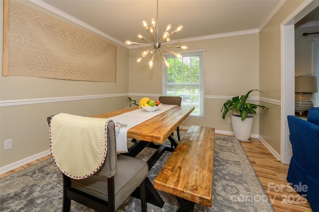 10316 Whitethorn Dr, Charlotte, NC 28277 - dining space featuring wood finished floors, crown molding, baseboards, and a notable chandelier