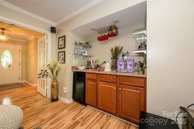 10316 Whitethorn Dr, Charlotte, NC 28277 - bar with a dry bar, ornamental molding, beverage cooler, and light wood finished floors