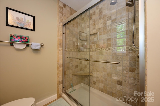 10316 Whitethorn Dr, Charlotte, NC 28277 - full bath featuring a shower stall, toilet, and baseboards