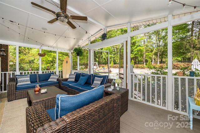 10316 Whitethorn Dr, Charlotte, NC 28277 - sunroom featuring rail lighting, ceiling fan, and an outdoor hangout area