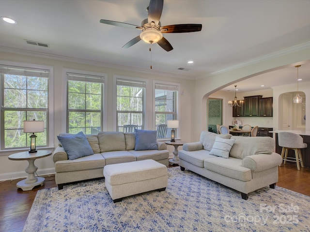 712 Chase Ct, Fort Mill, SC 29708 - living room featuring visible vents, arched walkways, ornamental molding, and a healthy amount of sunlight