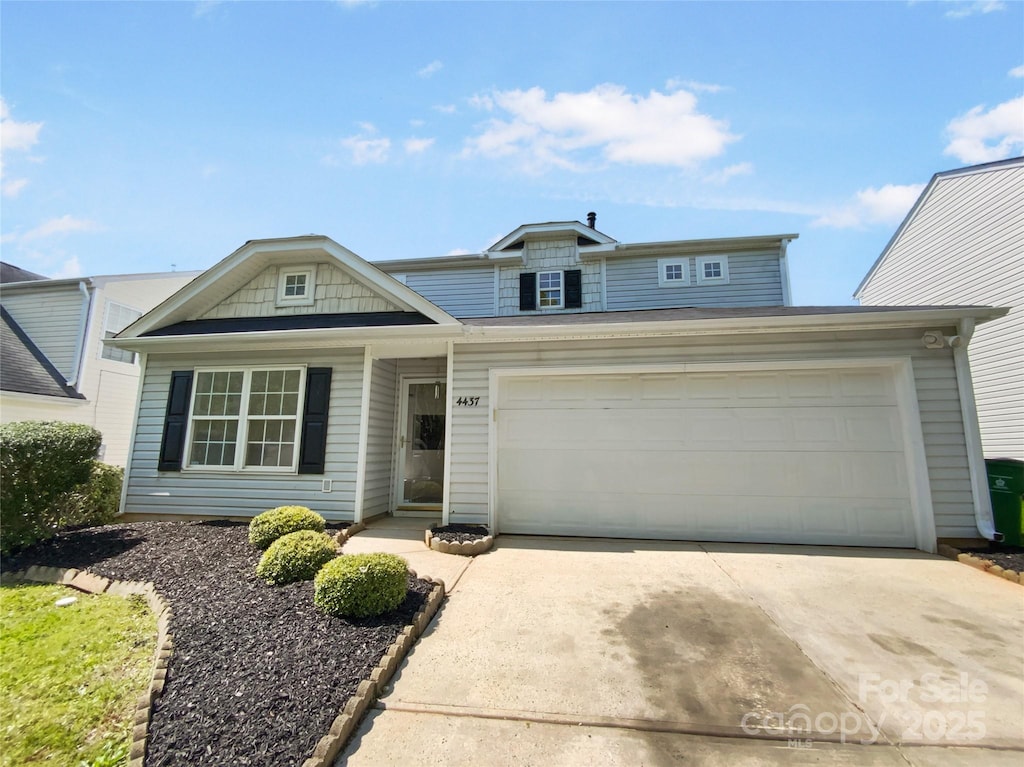 4437 Devonhill Ln, Charlotte, NC 28269 - traditional-style home featuring concrete driveway and an attached garage