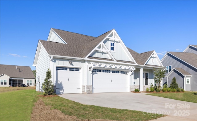 13279 Arnold Palmer Cir Unit 867, Lancaster, SC 29720 - view of front of property featuring board and batten siding, an attached garage, concrete driveway, a front yard, and roof with shingles