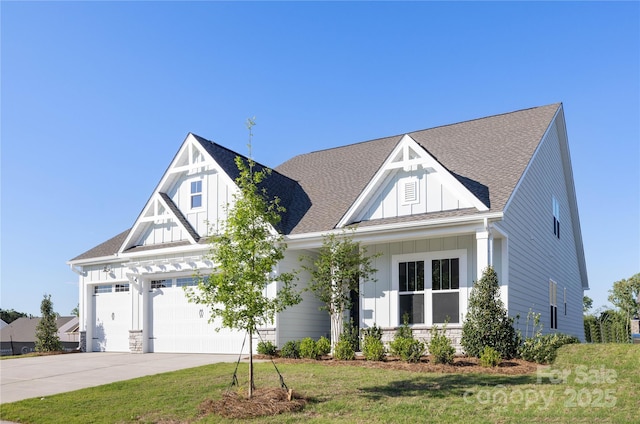 13279 Arnold Palmer Cir Unit 867, Lancaster, SC 29720 - view of front of property featuring board and batten siding, driveway, a garage, a shingled roof, and a front yard