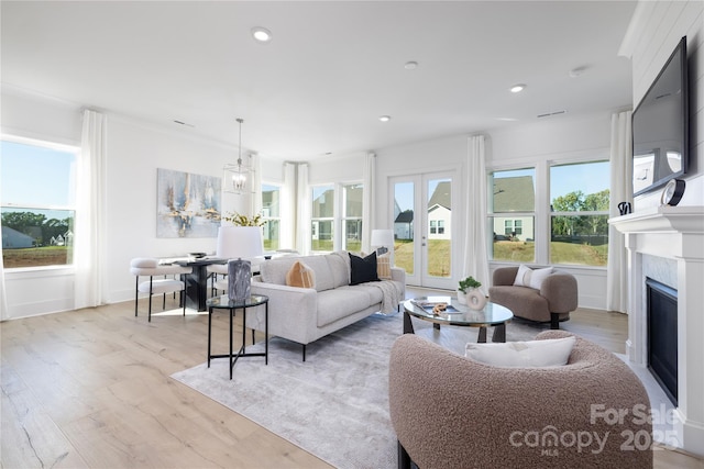 13279 Arnold Palmer Cir Unit 867, Lancaster, SC 29720 - living room featuring light wood-style floors, plenty of natural light, a premium fireplace, and recessed lighting
